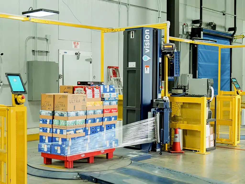 Rehrig Pacific's Vision Object Recognition Technology Smart Pallet Wrapper in a Warehouse