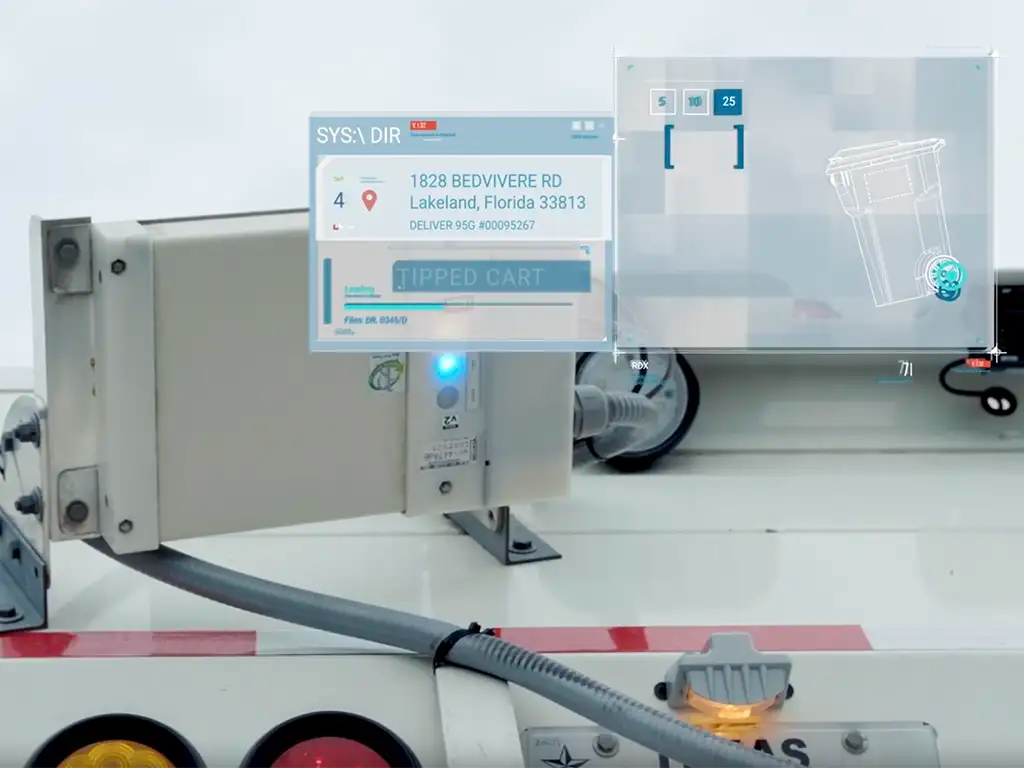 Garbage Truck using visual verification technology to scan a bin